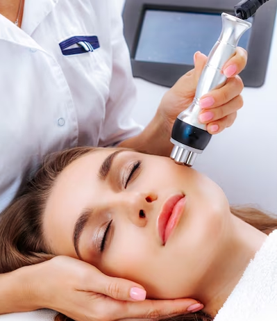 Woman receiving laser skin treatment for acne scars
